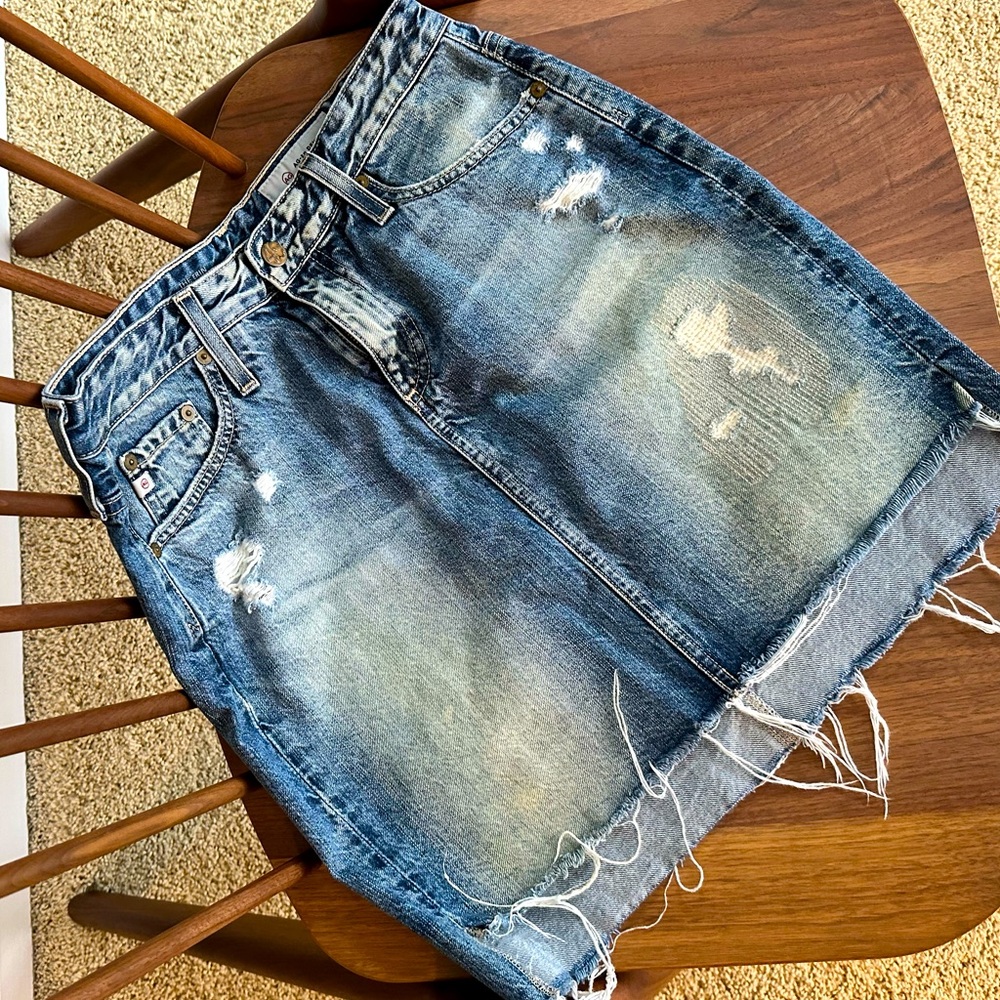 AG The Sandy denim mini skirt, distressed & slight hi-low design.